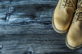 Safety boots on vintage wooden board
