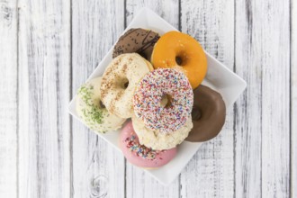 Portion of some Donuts as detailed close-up shot (fresh made, selective focus)