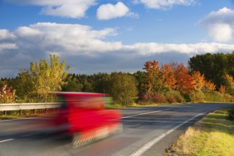 Speed car on a road in Krkonose mountain, Czech Republic, Europe