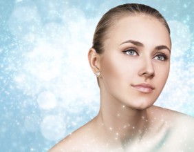 Portrait of young and beautiful woman over winter Christmas background. Spa concept