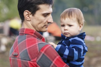 Portrait of happy father and son outdoors