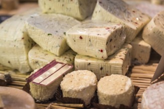 Pieces of delicious white goat cheese with spices