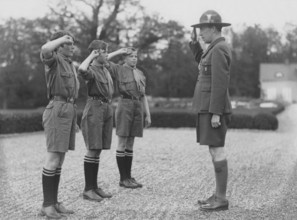 Folke Bernadotte, 1895-1948, leader of the swedish scouts movement saluting three boy scouts in the