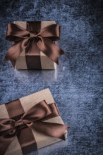Wrapped vintage gift boxes on metallic background holiday concept