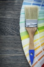 Paintbrushes color pantone fan on wooden board