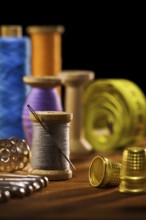 Sewing items on brown wooden bards