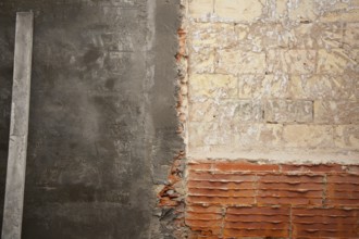 Brickwall construction and mortar cement plaster with rulers