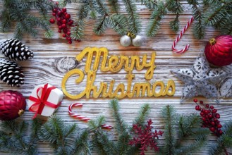 Merry Christmas spell word on white wood background