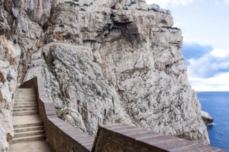 The incredible staircase of Neptuno cave in the morning. Alghero, Sardinia. Italy