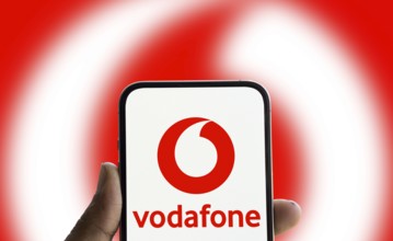 Vodafone logo is displayed on smartphone.