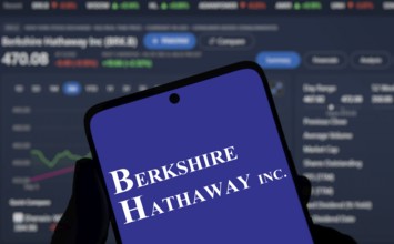 Berkshire Hathaway inc logo is displayed on smartphone. Berkshire Hathaway Inc is an American