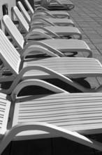 White resin solarium hammocks row black and white