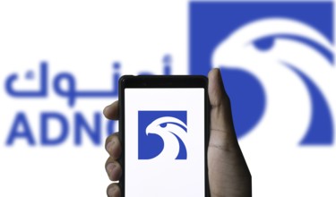Abu Dhabi National Oil Company (ADNOC) on smartphone.