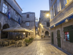 Restaurant tables, old town centre of Korcula, Korcula island, Dalmatia, Croatia, Europe