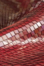 Covering of a building with the use of modern tiles of red color