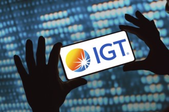 In this photo illustration, the International Game Technology (IGT) logo is displayed on a