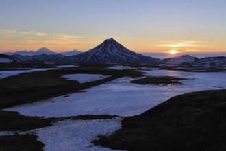 Volcanic landscape of Kamchatka Peninsula: beautiful sunrise over Viluchinsky Volcano. Asia,