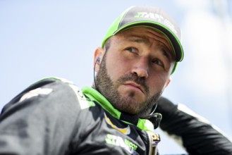 AGUSTIN HUGO CANAPINO (R) (78) of Arrecifes, Argentina suits up on pit road prior to practice for