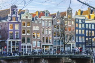 Beautiful dutch houses in Amsterdam city at sunset