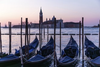 Dawn, Venetian gondolas with the church of San Giorgio Maggiore in the background, Venice, UNESCO