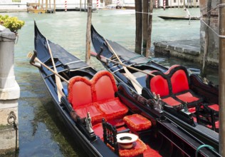 Ancient gondolas boat in Venice. Gondola red color interior