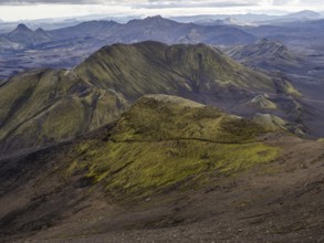View from Mount Sveinstindur, volcanic landscape, moss-covered hills, mountains, Icelandic