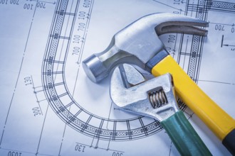 Claw hammer adjustable key on blueprint building and architecture concept