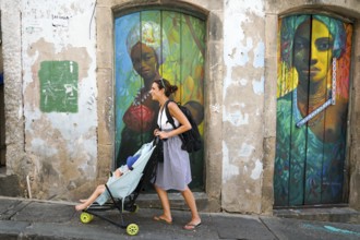Tourist walking in the colorful historic district of Pelourinho, Bahia, Brazil. Historic
