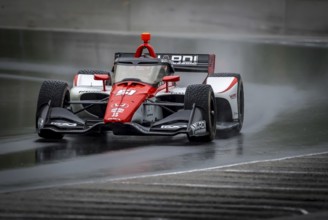 LUCA GHIOTTO (R) (51) of Arzignano, Italy comes through turn 12 (Canada Corner) during a wet