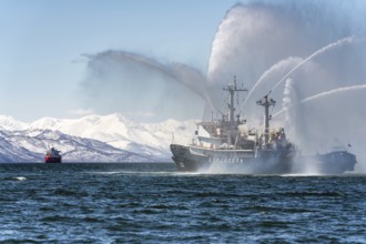 KAMCHATKA, RUSSIA, APR 27, 2019: Firefighting and rescue ship of Pacific Fleet of Russia spraying