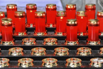 Red prayer candles lit for sacred devotion, Assisi, Umbria, Italy, Europe