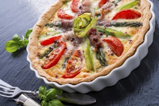 Green asparagi Tart with eggs and tomato