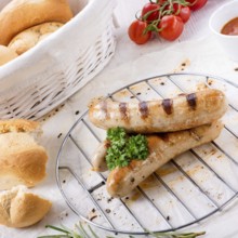 Delicious bratwurst with ketchup and fresh rolls