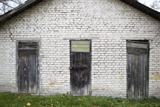 Three doors in the old grey brick garage