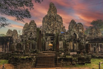 The famous Bayon temple with the ancient stone faces