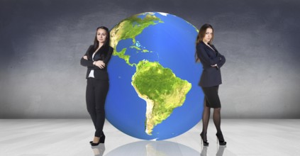 Business women stands near big earth ball in the gray room.Elements of this image furnished by NASA