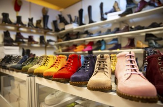 Colorful women boots/shoes are seen arranged
