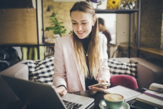 Beautiful Young Freelancer Woman Using Laptop Computer Sitting At Cafe Table. Businesswoman hand