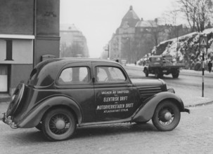 Electric car in the 1930s. An electric powered Ford car with information on the side that it's been