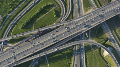 Aerial top view of lot of cars on modern road junction