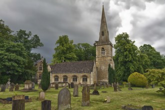 St Mary's Church with graveyard in Cotswolds, Lower Slaughter, UK