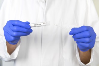 Doctor with covid-19 test set