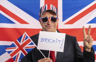 British male businessman with Brexit banner and UK flag
