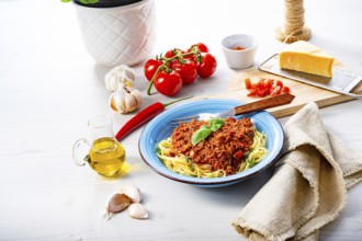 Delicious spaghetti bolognese on a white background