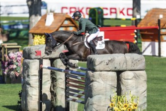 Denis Lynch of Ireland, riding Vistogrand compete in the BMO Nations Cup during the CSIO Spruce