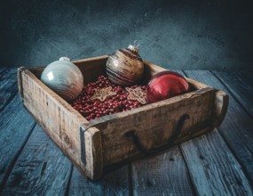 Christmas decorations in an old wooden box
