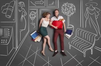 Love story concept of romantic couple shopping against chalk drawings background. Young happy