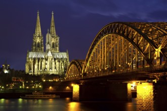 Cityscape of Cologne at dusk with cathedral and Hoherzollern Bridge Cologne, Germany, Europe