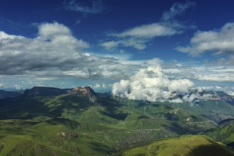 Aerial view on hills and mountains under clouds in Kabardino-Balkaria, Caucasus, Russia, Europe