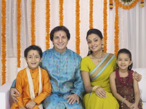 Parent with children in traditional wearing MR#779P, MR#779Q, MR#779R, MR#779S